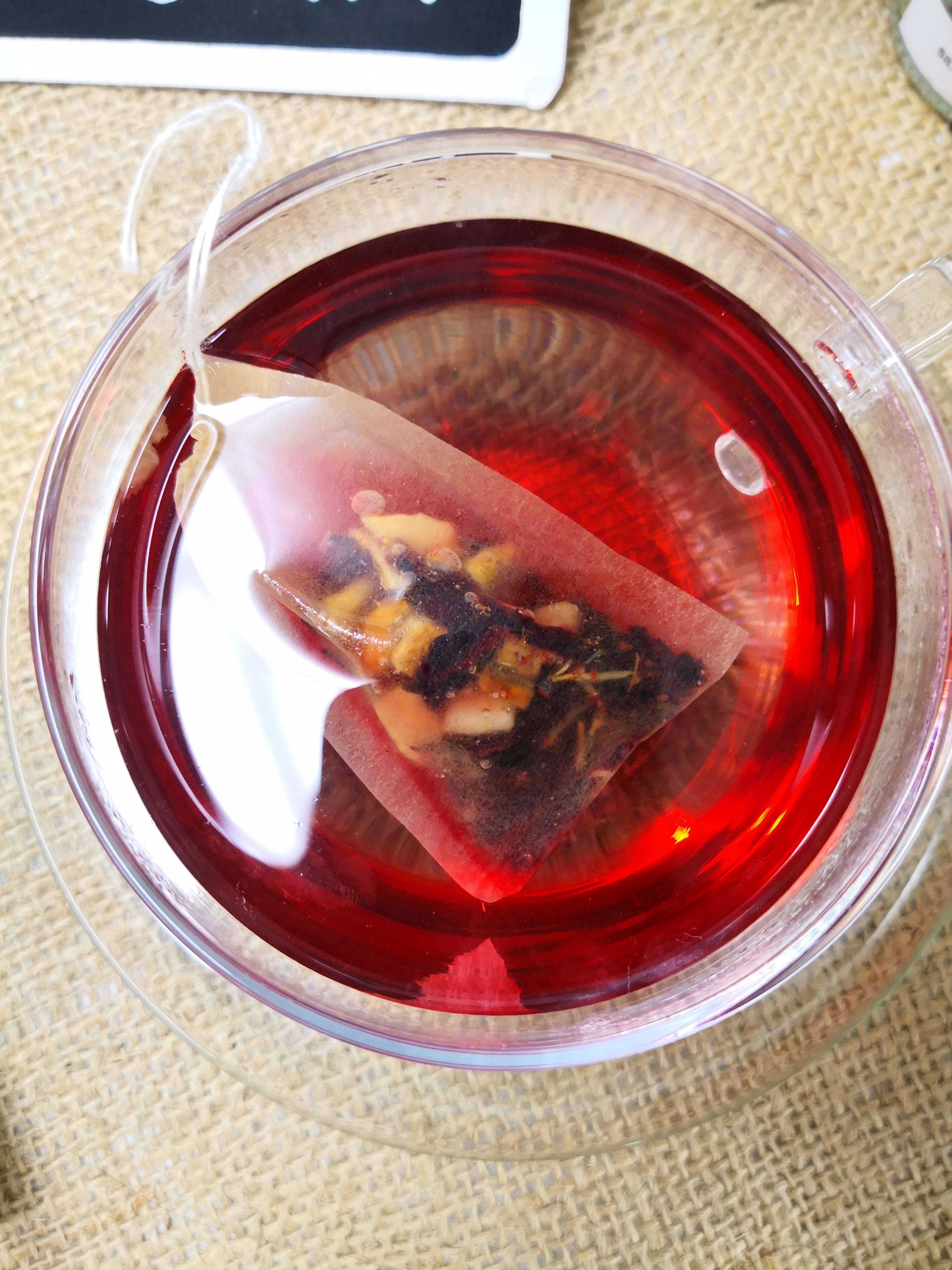 Close up of Biodegradable Self Fill Teabags in a clear teacup for loose leaf tea from Very Craftea