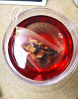 Close up of Biodegradable Self Fill Teabags in a clear teacup for loose leaf tea from Very Craftea